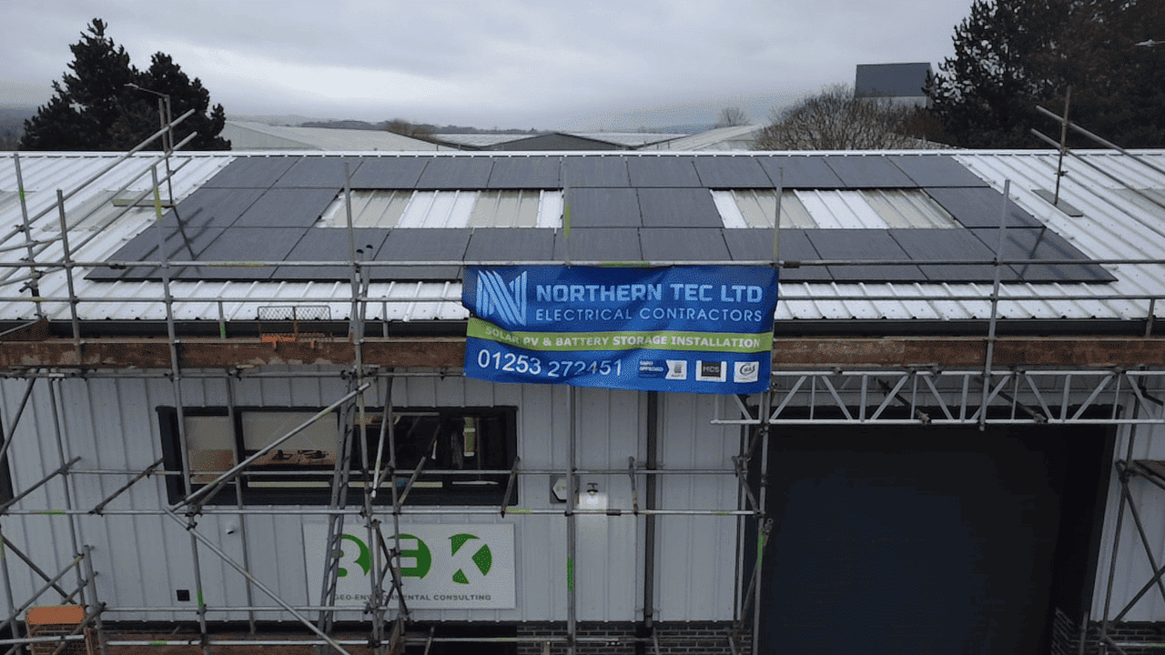Aerial view of completed commercial rooftop solar PV array