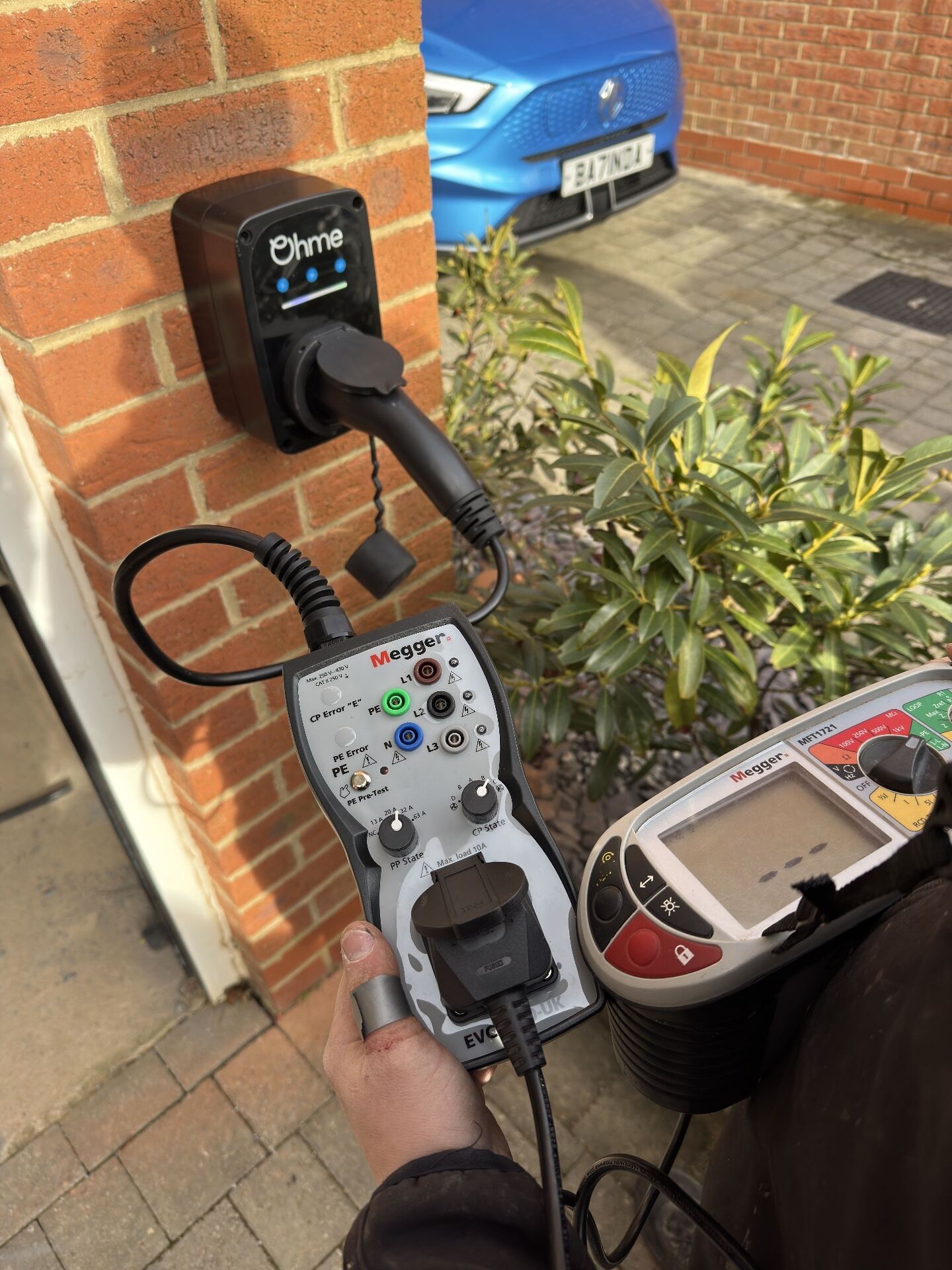 Tethered home EV charge point installation on brickwork