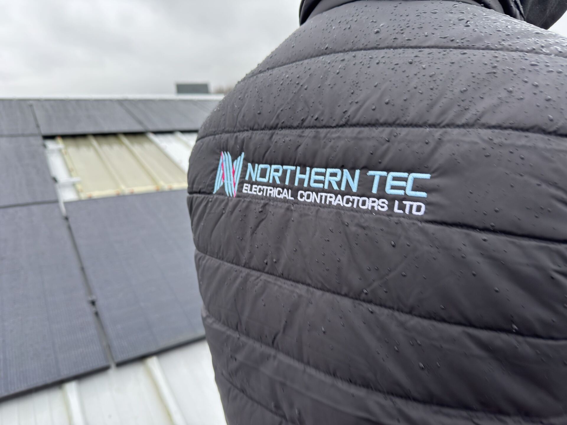Solar PV inverters and DC isolators wall-mounted in a plant room